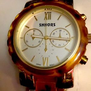 Gold and brown/gold SHHORS Quartz water-resistant link watch.